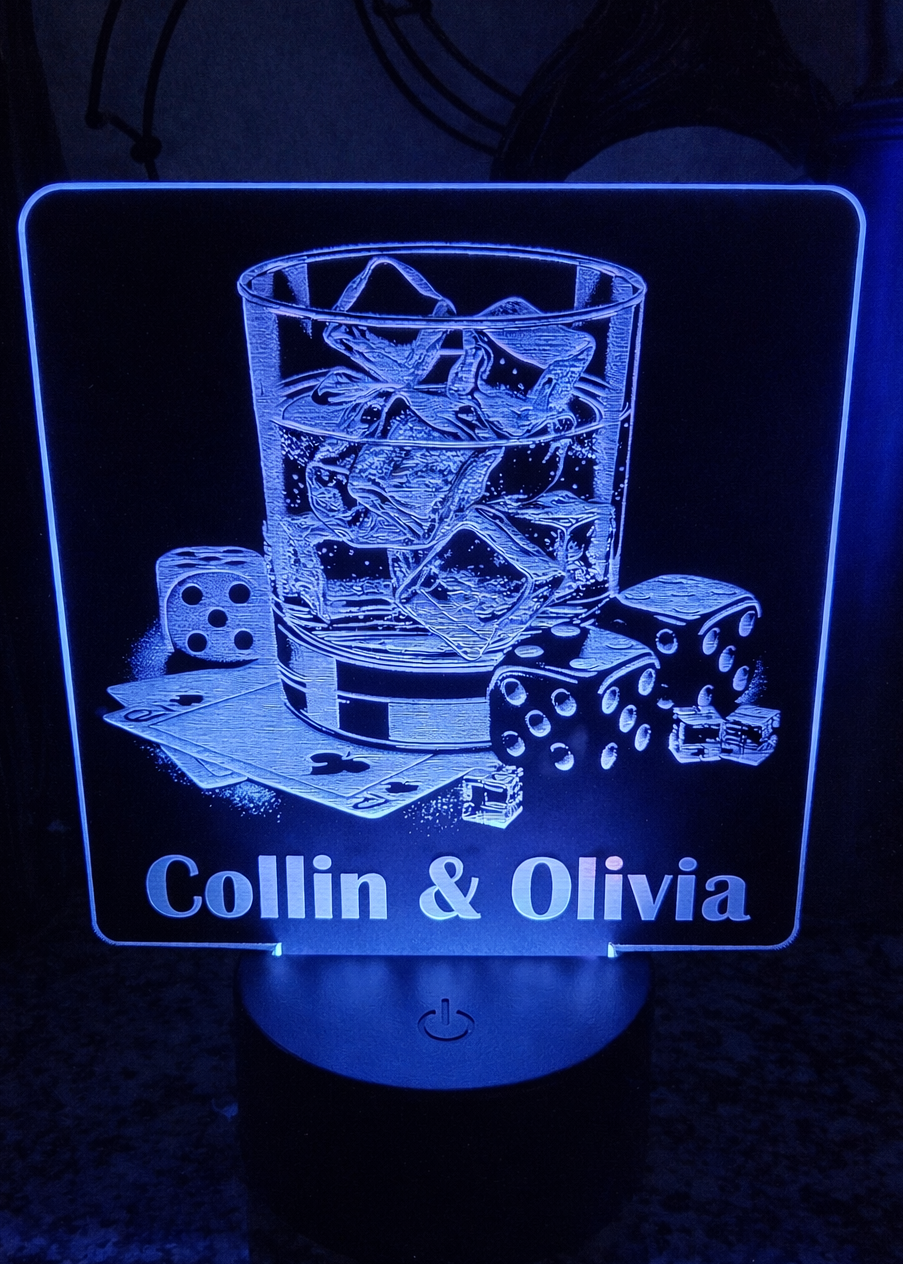 Laser engraved black acrylic with whiskey glass, cards, and dice