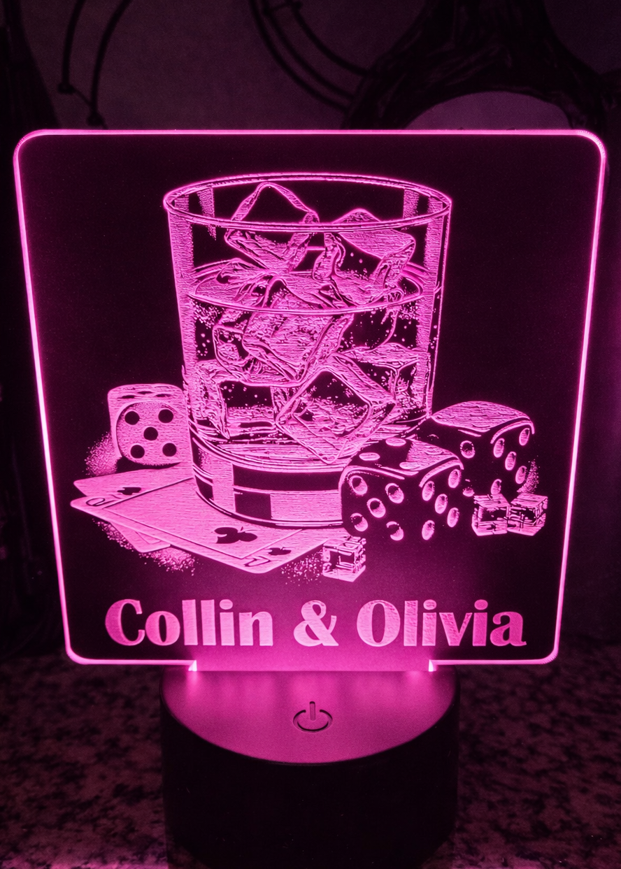 Laser engraved black acrylic with whiskey glass, cards, and dice