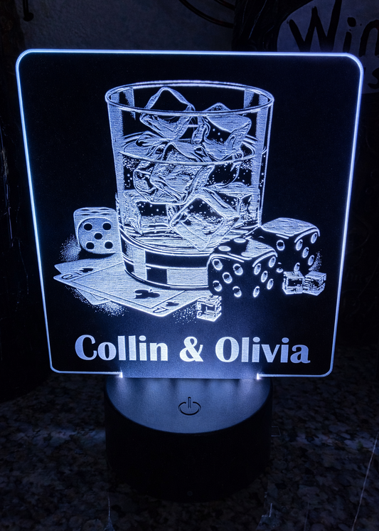 Laser engraved black acrylic with whiskey glass, cards, and dice